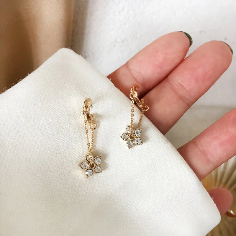 Petite Flower Charms Dangling from Gold Hoop Earrings