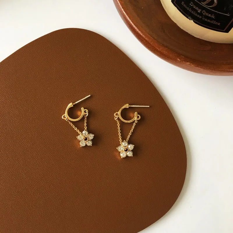 Petite Flower Charms Dangling from Gold Hoop Earrings