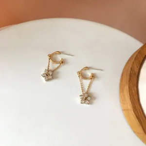 Petite Flower Charms Dangling from Gold Hoop Earrings